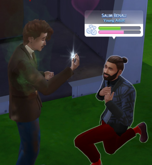 A Sims 4 screenshot, Salim down on one knee proposing to Miguel. Miguel, stinky, holds the ring in his hand and smiles.