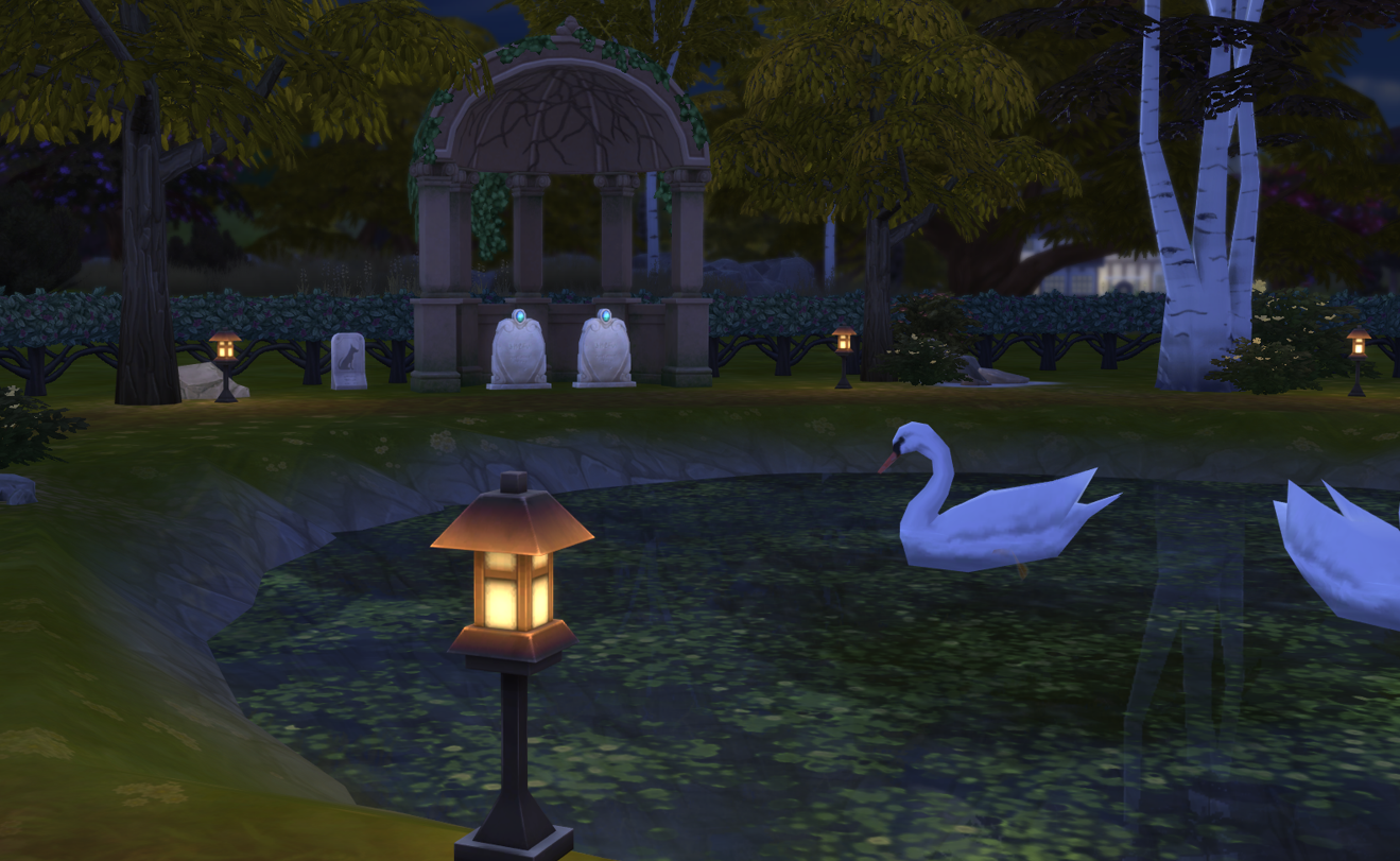 A Sims 4 screenshot, Miguel and Salim's gravestones in a park with a pond, together again.